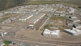 4K aerial stock footage orbit a prison complex in Otay Mesa, California Aerial Stock Footage | DCA08_105E