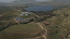 4K aerial stock footage of a lakeside water treatment plant, Lower Otay Lake, California Aerial Stock Footage | DCA08_107
