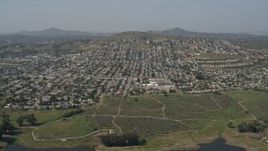 4K aerial stock footage tilt to reveal reservoir and suburban neighborhoods, Spring Valley, California Aerial Stock Footage | DCA08_122