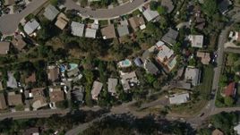 4K aerial stock footage of a bird's eye of a suburban neighborhood, reveal strip mall, freeway interchange, high school, La Mesa, California Aerial Stock Footage | DCA08_131E