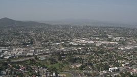 4K aerial stock footage tilt from suburban homes to reveal shopping mall, La Mesa, California Aerial Stock Footage | DCA08_133