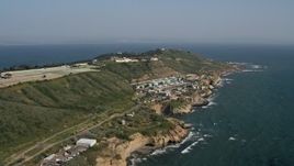 4K aerial stock footage of coastal cliffs and a water treatment plant, Point Loma, California Aerial Stock Footage | DCA08_165
