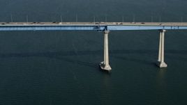 4K aerial stock footage tilt from sailboat to reveal the Coronado Bridge, San Diego, California Aerial Stock Footage | DCA08_183