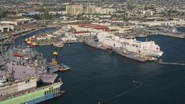 4K aerial stock footage orbit Red Cross hospital ship at shipyard, San Diego, California Aerial Stock Footage | DCA08_185E