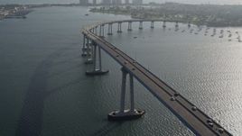 4K aerial stock footage of tracking cars crossing the Coronado Bridge, San Diego, California Aerial Stock Footage | DCA08_203