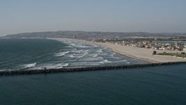 4K aerial stock footage fly over ocean waves to approach a beach and beachfront homes, Mission Beach, California Aerial Stock Footage | DCA08_229E