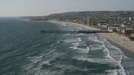 4K aerial stock footage of flying over a pier by coastal neighborhoods, Pacific Beach, California Aerial Stock Footage | DCA08_235