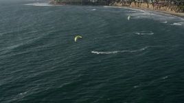 4K aerial stock footage approach kite surfers near coastal homes, Pacific Beach, California Aerial Stock Footage | DCA08_236E