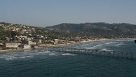 4K aerial stock footage tilt from the ocean to reveal a pier in La Jolla, California Aerial Stock Footage | DCA08_249