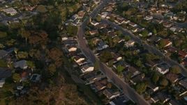 4K aerial stock footage video of a reverse view of tract homes, and reveal the freeway, Bay Ho, California, Sunset Aerial Stock Footage | DCA08_275