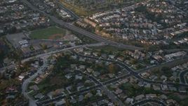 4K aerial stock footage of suburban tract homes, reveal baseball field, Pacific Beach, California, Sunset Aerial Stock Footage | DCA08_283