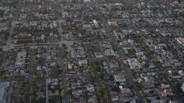 4K aerial stock footage reverse and pan across suburban houses and apartment buildings, Pacific Beach, California, Sunset Aerial Stock Footage | DCA08_284