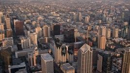 4K aerial stock footage of panning over the city while flying over skyscrapers, Downtown San Diego, California, Sunset Aerial Stock Footage | DCA08_293