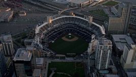 4K aerial stock footage approach and orbit a baseball stadium in Downtown San Diego, California, Sunset Aerial Stock Footage | DCA08_294E