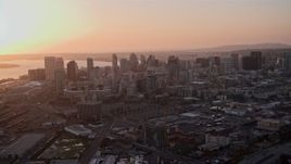 4K aerial stock footage approach skyscrapers in Downtown San Diego, California, Sunset Aerial Stock Footage | DCA08_301
