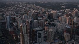 4K aerial stock footage of panning across skyscrapers in Downtown San Diego, California, Sunset Aerial Stock Footage | DCA08_310
