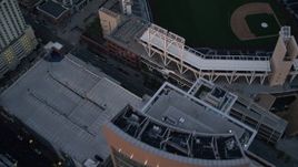 4K aerial stock footage of a bird's eye view of city streets, and reveal a baseball stadium, Downtown San Diego, California, Sunset Aerial Stock Footage | DCA08_312