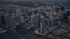 4K aerial stock footage of panning across skyscrapers in Downtown San Diego, California, Sunset Aerial Stock Footage | DCA08_323