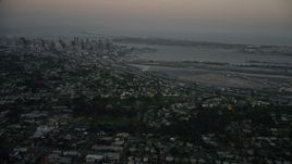 4K aerial stock footage of Downtown San Diego and San Diego International Airport, California, twilight Aerial Stock Footage | DCA08_330E