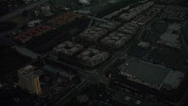 4K aerial stock footage fly away from apartment buildings and reveal a freeway, Mission Valley, California, twilight Aerial Stock Footage | DCA08_335