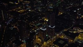 4K aerial stock footage approach and tilt to city skyscrapers in Downtown San Diego, California, Night Aerial Stock Footage | DCA08_346