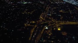 4K aerial stock footage of tilt from freeway to reveal interchange at night in Downtown San Diego, California Aerial Stock Footage | DCA08_351