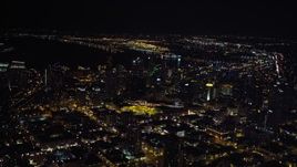 4K aerial stock footage of tilting from city buildings to skyscrapers, Downtown San Diego, California, Night Aerial Stock Footage | DCA08_359
