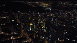 4K aerial stock footage of tilting to skyscrapers from a wide view of Downtown San Diego, California, Night Aerial Stock Footage | DCA08_360