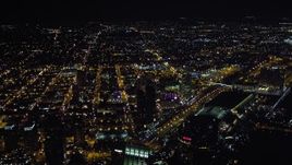 4K aerial stock footage tilt to reveal luxury hotels, skyscrapers, and city sprawl, Downtown San Diego, California, Night Aerial Stock Footage | DCA08_363