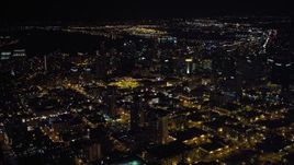 4K aerial stock footage of flying by city skyscrapers in Downtown San Diego, California at night Aerial Stock Footage | DCA08_367