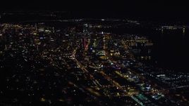4K aerial stock footage of passing city skyscrapers in Downtown San Diego, California, Night Aerial Stock Footage | DCA08_372