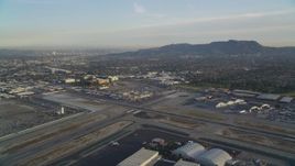 5K aerial stock footage approach runways and terminals at Burbank Airport at sunset, California Aerial Stock Footage | DCLA_001