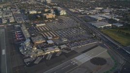 5K aerial stock footage of terminals and parking lots at the Burbank Airport at sunset, California Aerial Stock Footage | DCLA_003