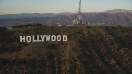 5K aerial stock footage flyby the Hollywood Hills to reveal the Hollywood Sign at sunset, California Aerial Stock Footage | DCLA_006