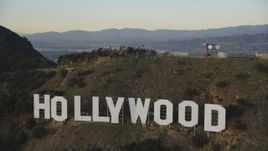 5K aerial stock footage tilt to reveal and fly over the Hollywood Sign at sunset, California Aerial Stock Footage | DCLA_007
