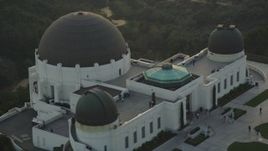 5K aerial stock footage orbit the Griffith Observatory with people on the grounds at sunset, California Aerial Stock Footage | DCLA_008