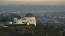 5K aerial stock footage flyby the west side of the Griffith Observatory at sunset, California Aerial Stock Footage | DCLA_010