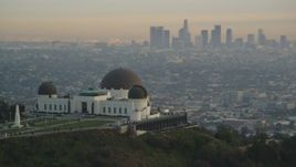 5K aerial stock footage orbit Griffith Observatory to reveal Downtown Los Angeles skyline at sunset, California Aerial Stock Footage | DCLA_011