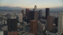 5K aerial stock footage tilt from city streets to reveal and approach Downtown Los Angeles at sunset, California Aerial Stock Footage | DCLA_025