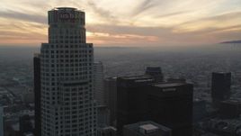 5K aerial stock footage fly over Downtown Los Angeles by US Bank Tower to approach setting sun, California Aerial Stock Footage | DCLA_038