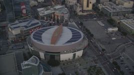 5K aerial stock footage tilt from Staples Center to reveal Downtown Los Angeles at sunset, California Aerial Stock Footage | DCLA_041