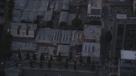 5K aerial stock footage track police helicopter pounding Downtown Los Angeles high-rise at twilight, California Aerial Stock Footage | DCLA_053