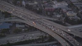 5K aerial stock footage track police helicopter over freeway gridlock at twilight in Downtown Los Angeles, California Aerial Stock Footage | DCLA_059