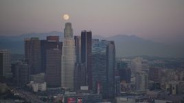 5K aerial stock footage of full moon over Downtown Los Angeles skyscrapers at twilight, California Aerial Stock Footage | DCLA_062