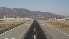 5K aerial stock footage tilt and fly over the runway at Bob Hope International Airport in Burbank, California Aerial Stock Footage | DCLA_104