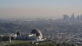 5K aerial stock footage orbit Griffith Observatory to reveal Downtown Los Angeles skyline, California Aerial Stock Footage | DCLA_113