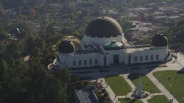 5K aerial stock footage flyby Griffith Observatory with visitors on grounds in Los Angeles, California Aerial Stock Footage | DCLA_114