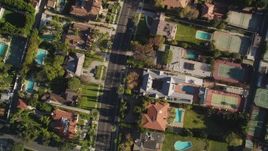 5K aerial stock footage of a bird's eye view of a street lined with mansions in Beverly Hills, California Aerial Stock Footage | DCLA_117