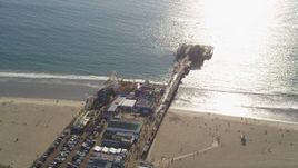 5K aerial stock footage of orbiting Santa Monica Pier on the beach in Los Angeles, California Aerial Stock Footage | DCLA_123