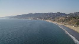 5K aerial stock footage of beach in Pacific Palisades seen from the Pacific Ocean, California Aerial Stock Footage | DCLA_131